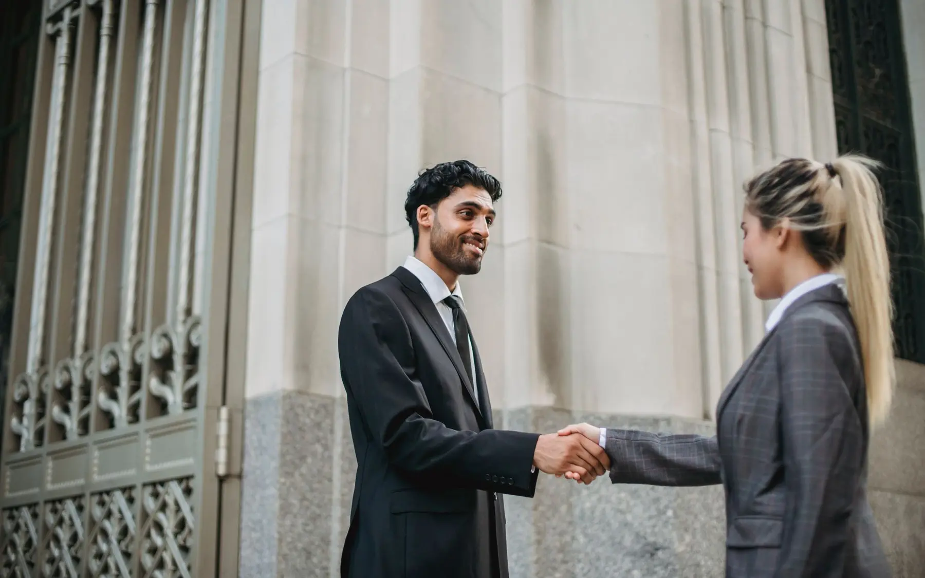 Business meeting near a modern office building